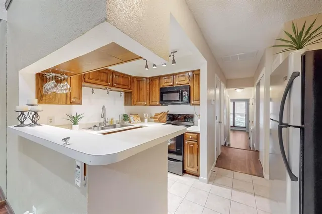 a view of a kitchen with furniture and a fireplace