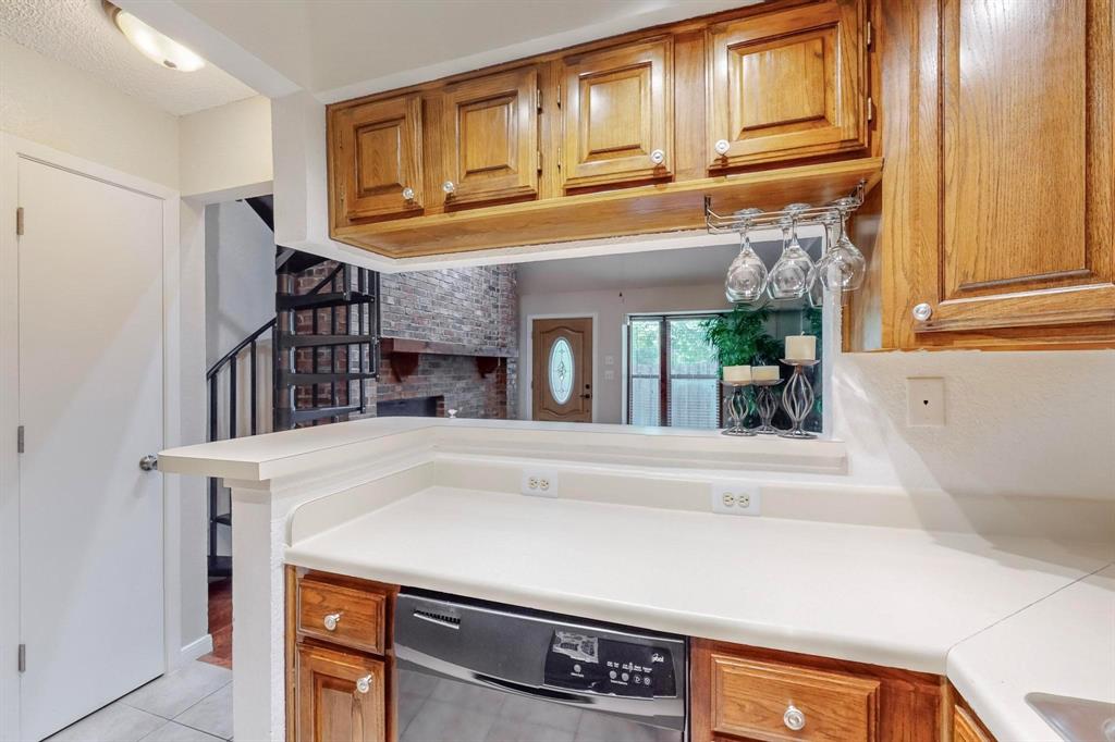 2569 Shady Ridge Drive Bedford, TX 76021 - Photo 17 of 38 a view of living room kitchen with furniture and large window