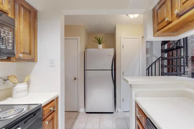 a kitchen with a stove and a microwave