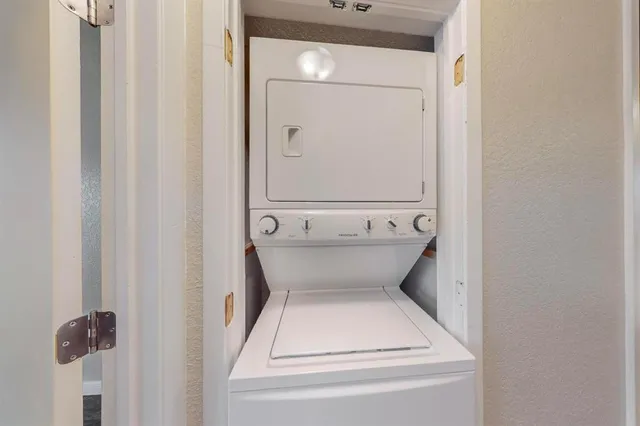 a kitchen with a refrigerator and a stove
