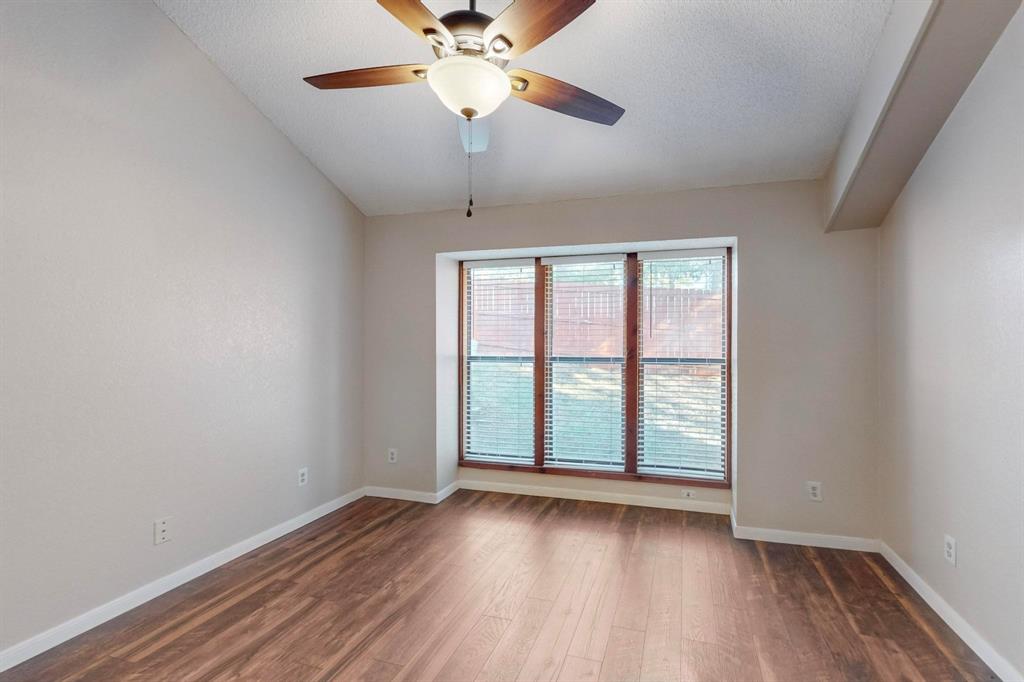 2569 Shady Ridge Drive Bedford, TX 76021 - Photo 24 of 38 wooden floor in an empty room with a window