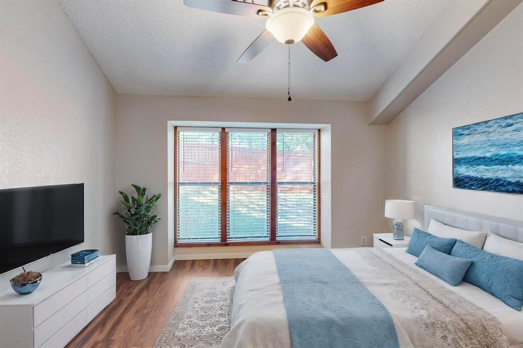 2569 Shady Ridge Drive Bedford, TX 76021 - Photo 25 of 38 a bedroom with a bed and flat screen tv