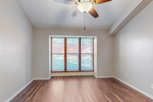 a bedroom with a bed and flat screen tv