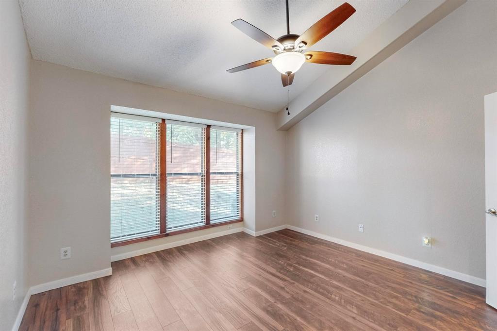 2569 Shady Ridge Drive Bedford, TX 76021 - Photo 29 of 38 wooden floor in an empty room with a window