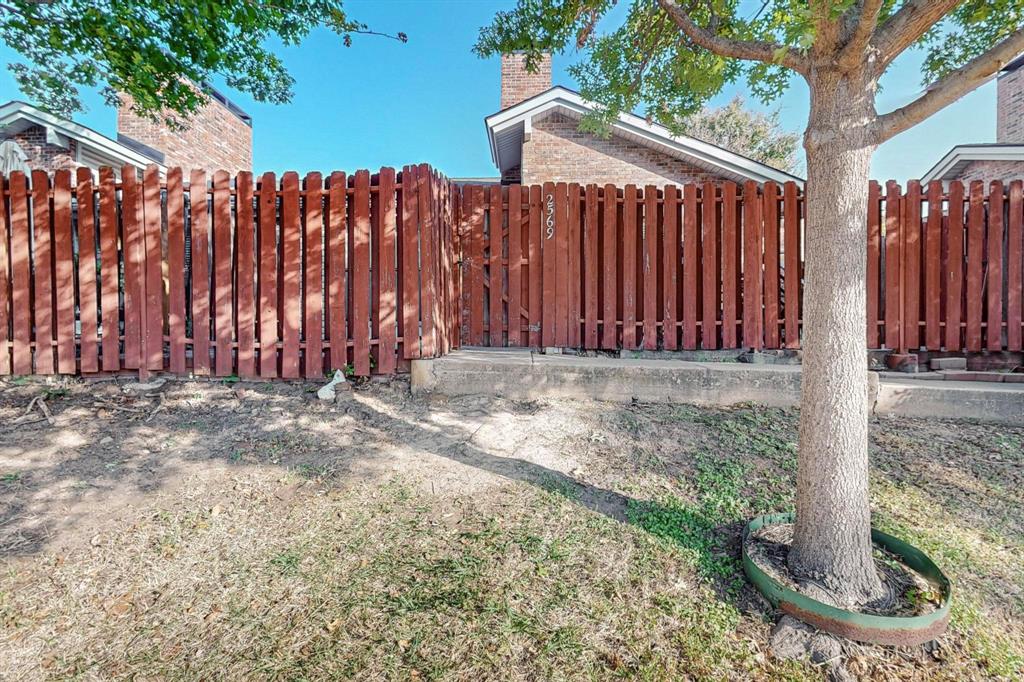 2569 Shady Ridge Drive Bedford, TX 76021 - Photo 2 of 38 a view of a backyard with a trees