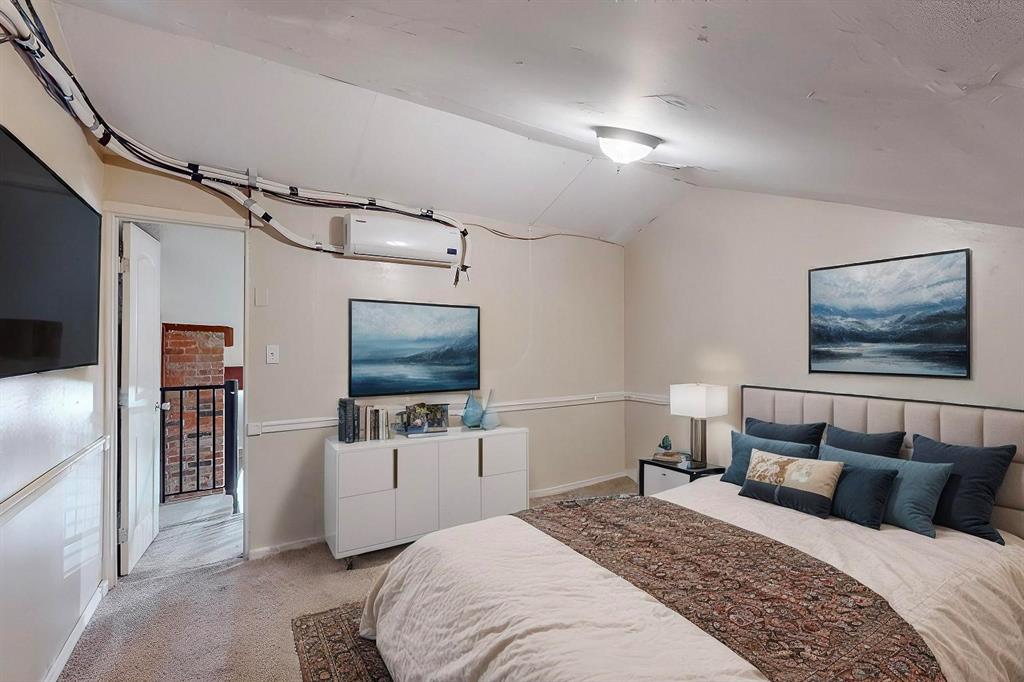 2569 Shady Ridge Drive Bedford, TX 76021 - Photo 31 of 38 a bedroom with a bed and a flat screen tv