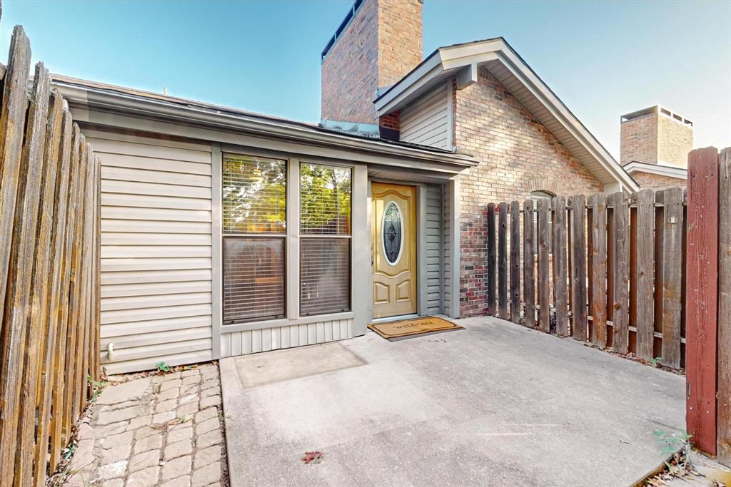 2569 Shady Ridge Drive Bedford, TX 76021 - Photo 3 of 38 a view of a house with a wooden fence