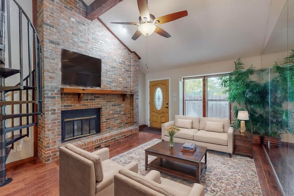 2569 Shady Ridge Drive Bedford, TX 76021 - Photo 7 of 38 a living room with furniture and a fireplace