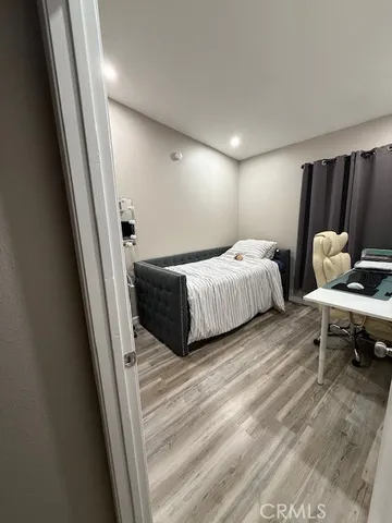 a bedroom with two beds and a couch
