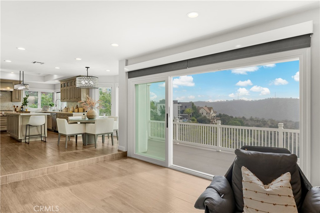 2640 Shady Ridge Lane Diamond Bar, CA 91765 - Photo 15 of 57 a living room with furniture a floor to ceiling window and kitchen view
