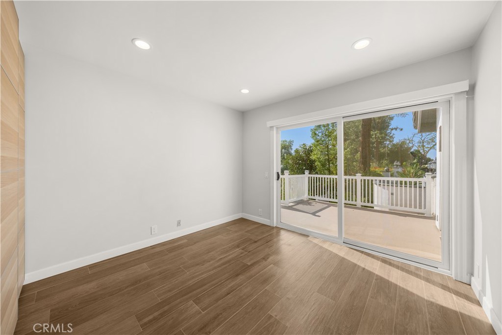 2640 Shady Ridge Lane Diamond Bar, CA 91765 - Photo 21 of 57 en empty room with wooden floor and windows