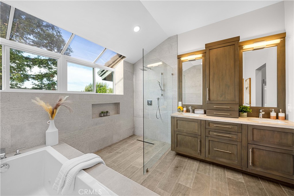 2640 Shady Ridge Lane Diamond Bar, CA 91765 - Photo 27 of 57 a spacious bathroom with a double vanity sink a large mirror and a bathtub