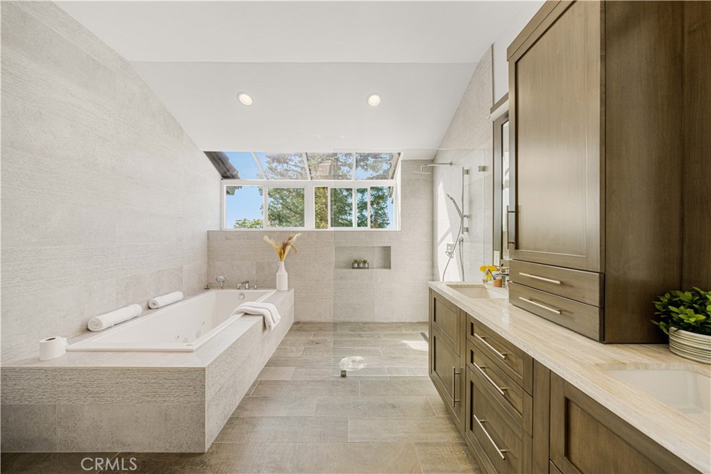 2640 Shady Ridge Lane Diamond Bar, CA 91765 - Photo 28 of 57 a bathroom with a tub sink and mirror