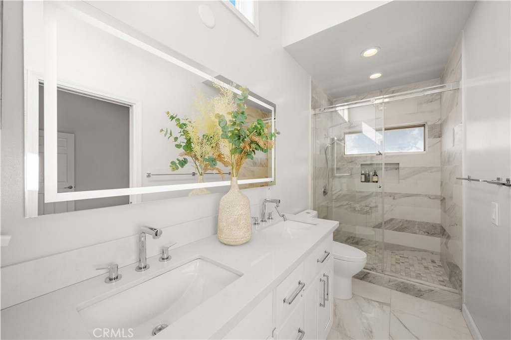 2640 Shady Ridge Lane Diamond Bar, CA 91765 - Photo 33 of 57 a bathroom with a double vanity sink mirror and double