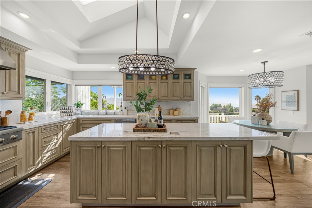 2640 Shady Ridge Lane Diamond Bar, CA 91765 - Photo 8 of 57 a kitchen with kitchen island granite countertop a sink a counter space and stainless steel appliances