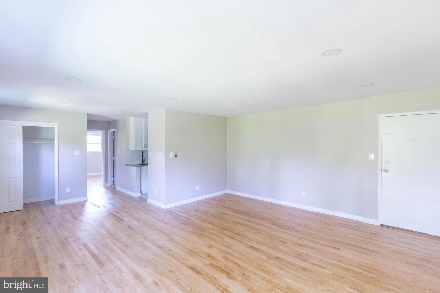 14698 Colchester Road Woodbridge, VA 22191 - Photo 3 of 15 a view of a big room with wooden floor and windows