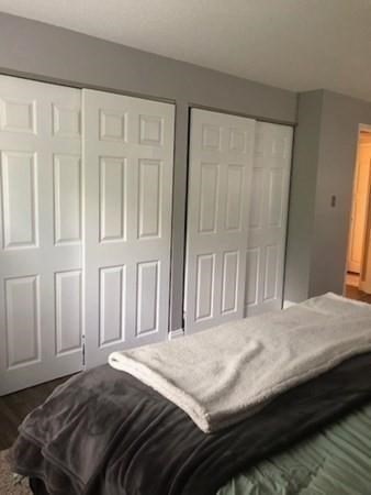 46 Silver Hill Lane, Unit 2 Natick, MA 01760 - Photo 16 of 23 a bedroom with a bed and a window