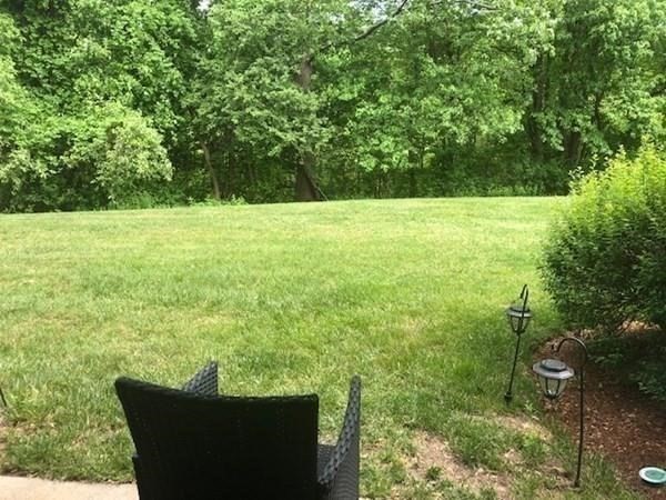 46 Silver Hill Lane, Unit 2 Natick, MA 01760 - Photo 19 of 23 a view of a green field with wooden fence