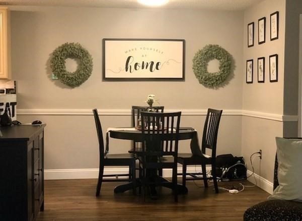 46 Silver Hill Lane, Unit 2 Natick, MA 01760 - Photo 2 of 23 a view of a dining room with furniture and wooden floor