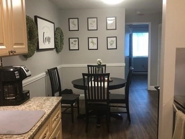 46 Silver Hill Lane, Unit 2 Natick, MA 01760 - Photo 8 of 23 a view of a dining room with furniture and wooden floor