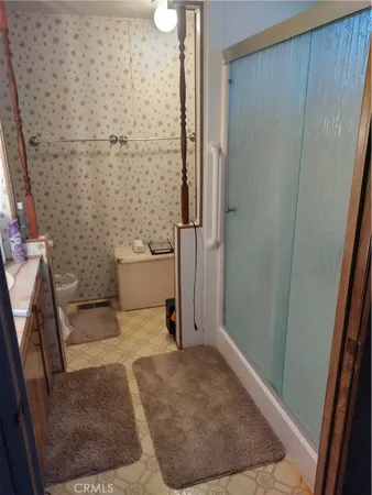 a view of room with air conditioner duct and materials on wall