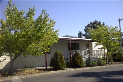 100 Yosemite Road, Unit 100 San Rafael, CA 94903 - Photo 1 of 5 a front view of a house with a yard