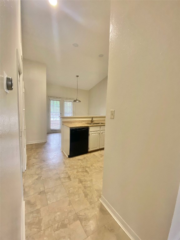 2216 San Gabriel Street, Unit 304 Austin, TX 78705 - Photo 13 of 24 Corridor with a sink and baseboards