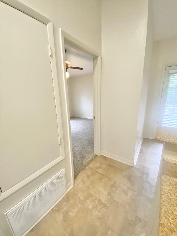 2216 San Gabriel Street, Unit 304 Austin, TX 78705 - Photo 18 of 24 Corridor with light tile patterned floors and visible vents