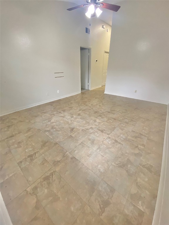 2216 San Gabriel Street, Unit 304 Austin, TX 78705 - Photo 3 of 24 Unfurnished room featuring a towering ceiling, visible vents, and a ceiling fan
