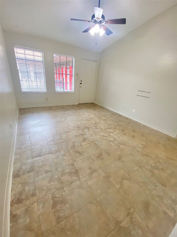 2216 San Gabriel Street, Unit 304 Austin, TX 78705 - Photo 4 of 24 Spare room featuring ceiling fan and baseboards