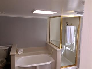 Broadway Burlingame, CA 94010 - Photo 19 of 21 a bathroom with a bathtub and a shower