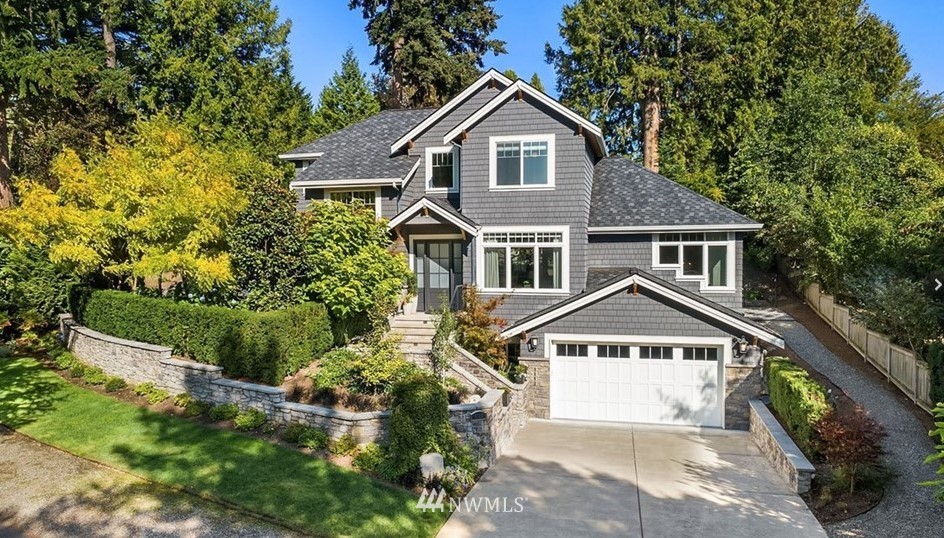 3112 Hunts Point Road Hunts Point, WA 98004 - Photo 1 of 1 a front view of a house with a yard and green space