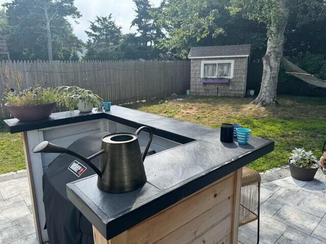 31 Susan Ruth Road Dennis Port, MA 02639 - Photo 13 of 17 31 Susanruth Rd - Backyard with gas gril