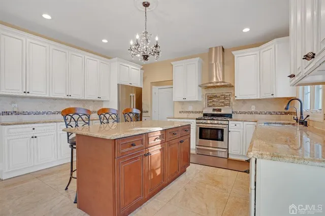 a kitchen with granite countertop a stove and cabinets