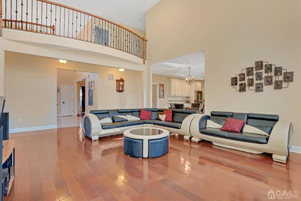 14 Harding Avenue Edison, NJ 08820 - Photo 14 of 41 a living room with furniture and a book shelf