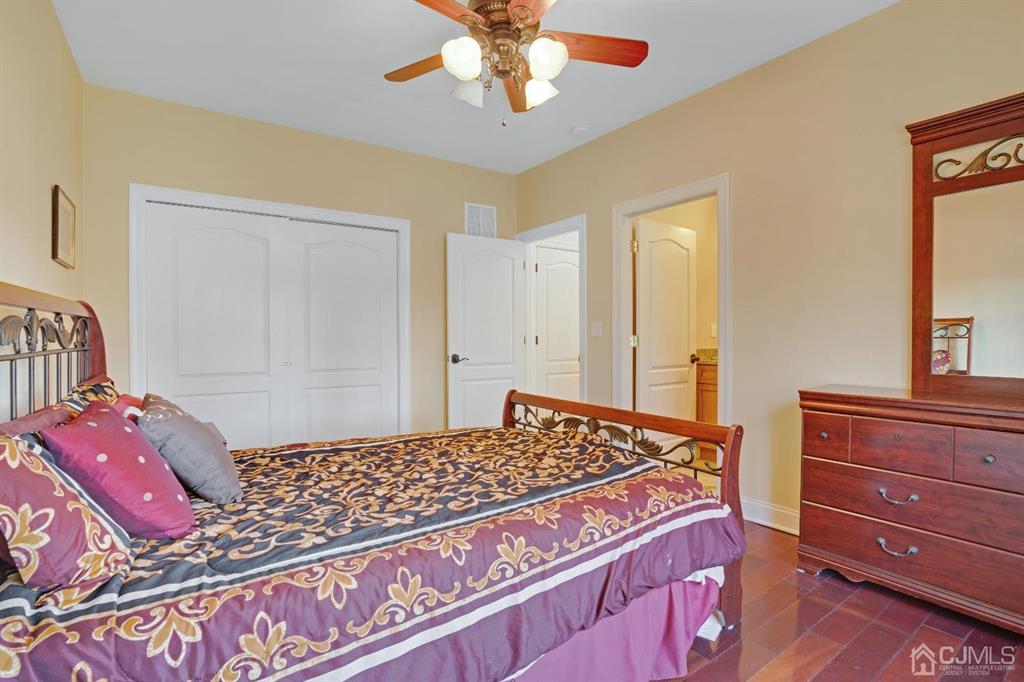 14 Harding Avenue Edison, NJ 08820 - Photo 18 of 41 a bedroom with a bed and a dresser in it