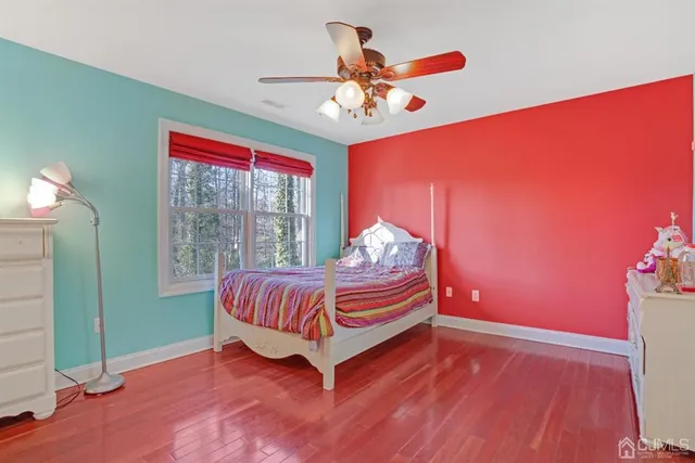 a living room with furniture and chandelier