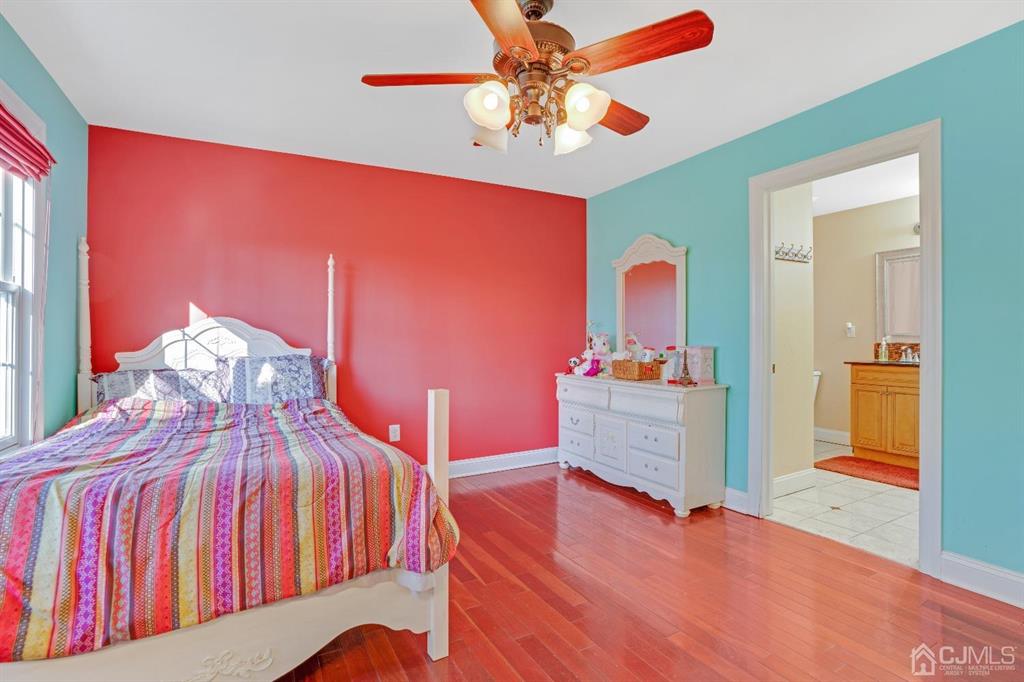 14 Harding Avenue Edison, NJ 08820 - Photo 28 of 41 a bedroom with furniture and a wooden floor