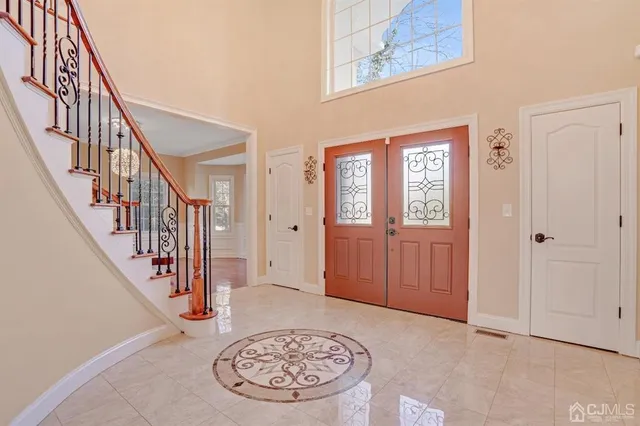 a view of an entryway with wooden floor