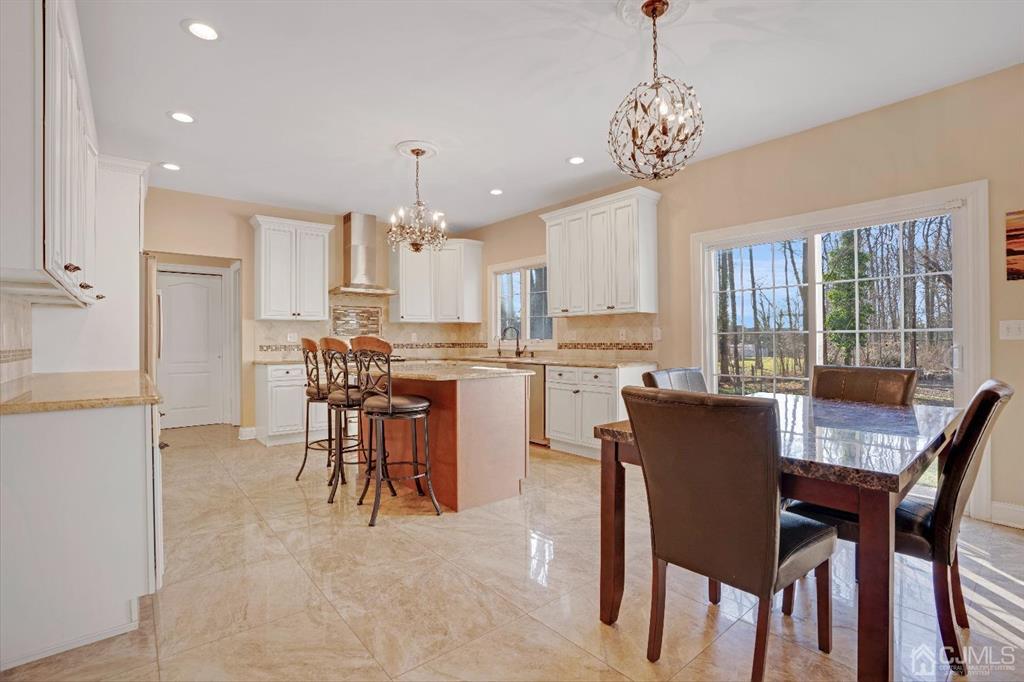 14 Harding Avenue Edison, NJ 08820 - Photo 10 of 41 a dining room filled chandelier and kitchen view