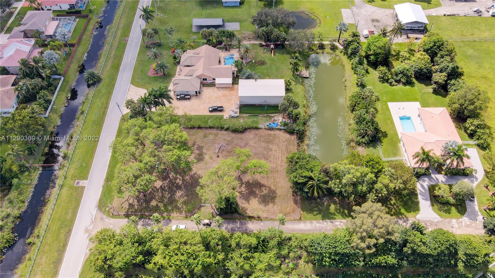 Sw Southwest 67th Place Southwest Ranches, FL 33331 - Photo 3 of 6 an aerial view of a house with a yard