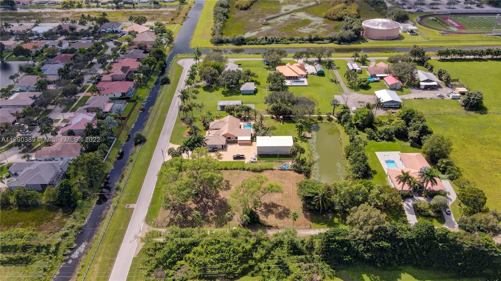 Sw Southwest 67th Place Southwest Ranches, FL 33331 - Photo 4 of 6 an aerial view of residential house with outdoor space and swimming pool