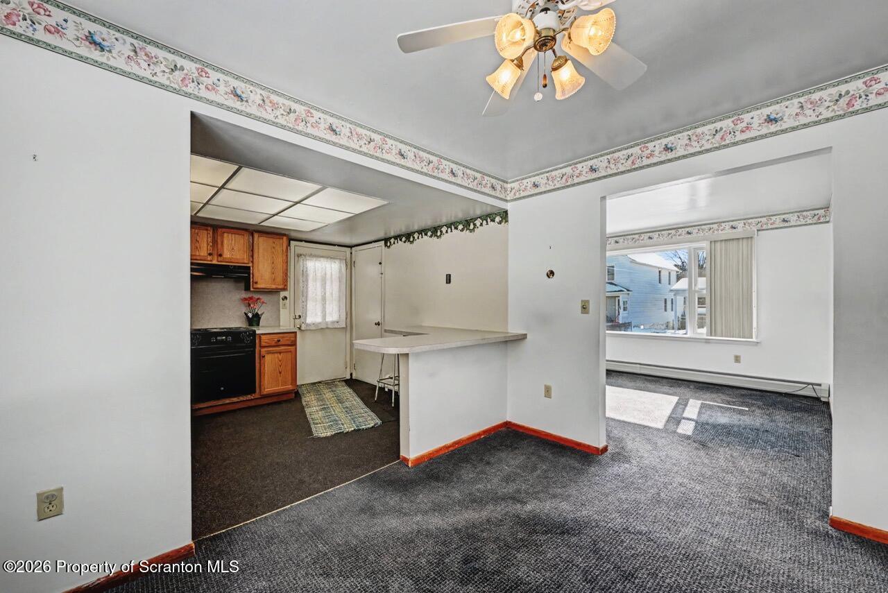 30 Glinko Street Scranton, PA 18504 - Photo 11 of 41 a living room with stainless steel appliances kitchen island granite countertop furniture and a fireplace