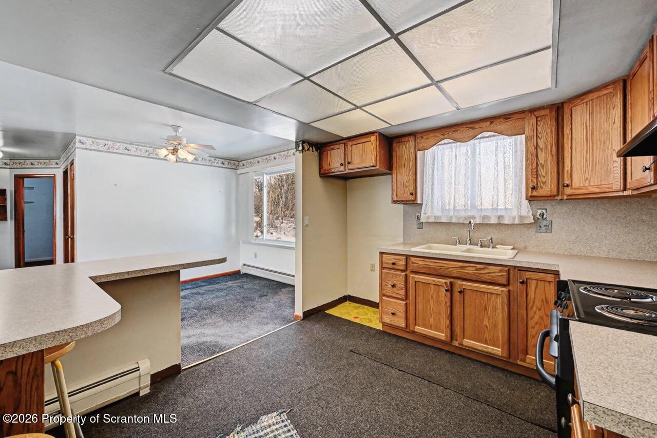 30 Glinko Street Scranton, PA 18504 - Photo 14 of 41 a kitchen with stainless steel appliances granite countertop a sink and cabinets