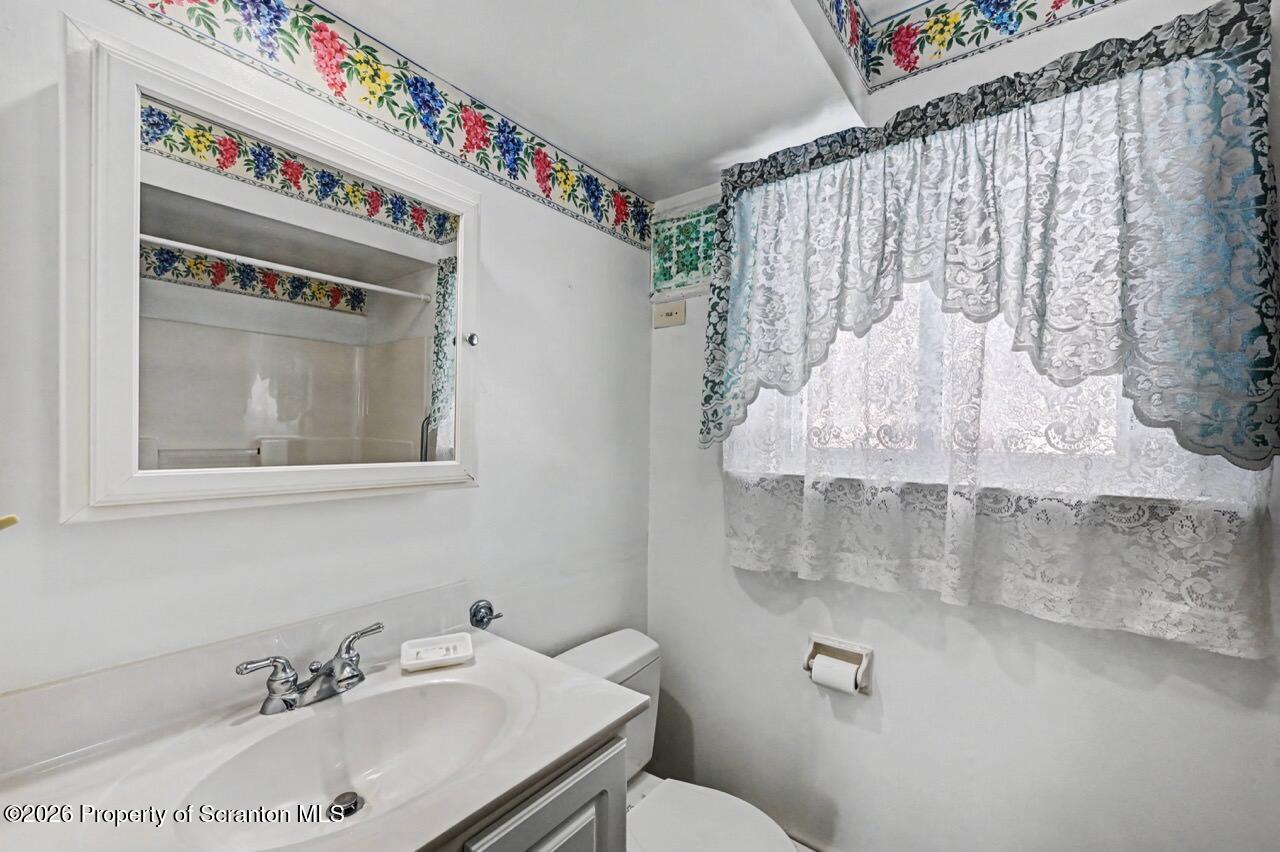 30 Glinko Street Scranton, PA 18504 - Photo 24 of 41 a bathroom with a sink and mirror with toilet
