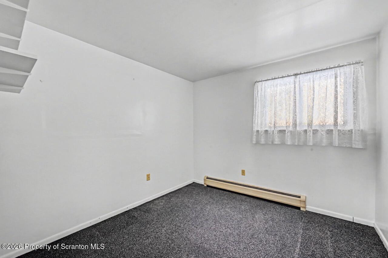 30 Glinko Street Scranton, PA 18504 - Photo 31 of 41 a very nice looking room with a chair
