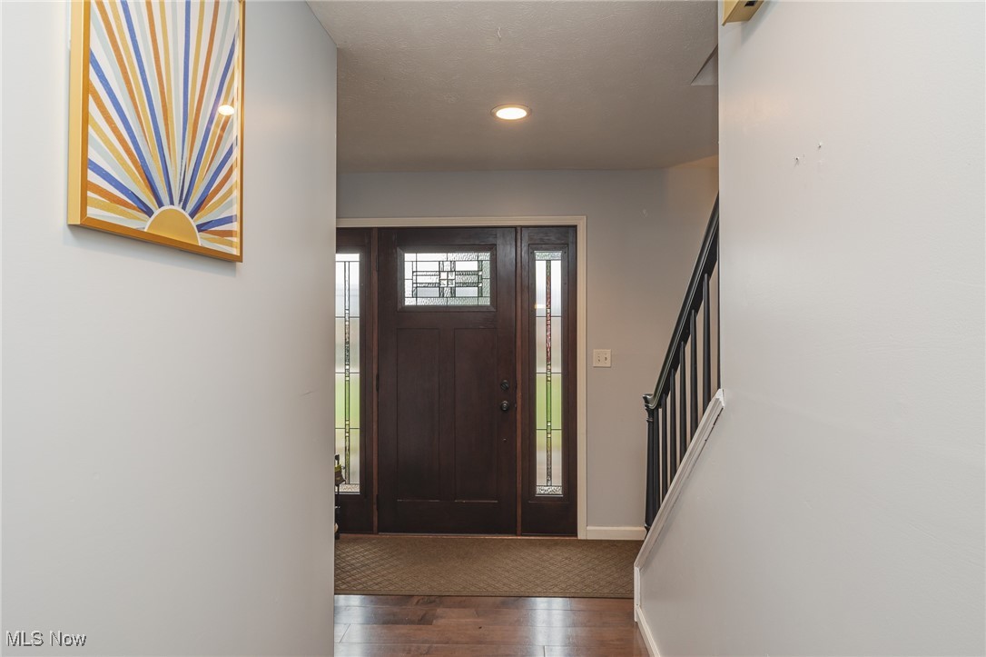 7711 Diagonal Road Kent, OH 44240 - Photo 18 of 45 Entrance foyer featuring dark wood-type flooring, recessed lighting, and stairs