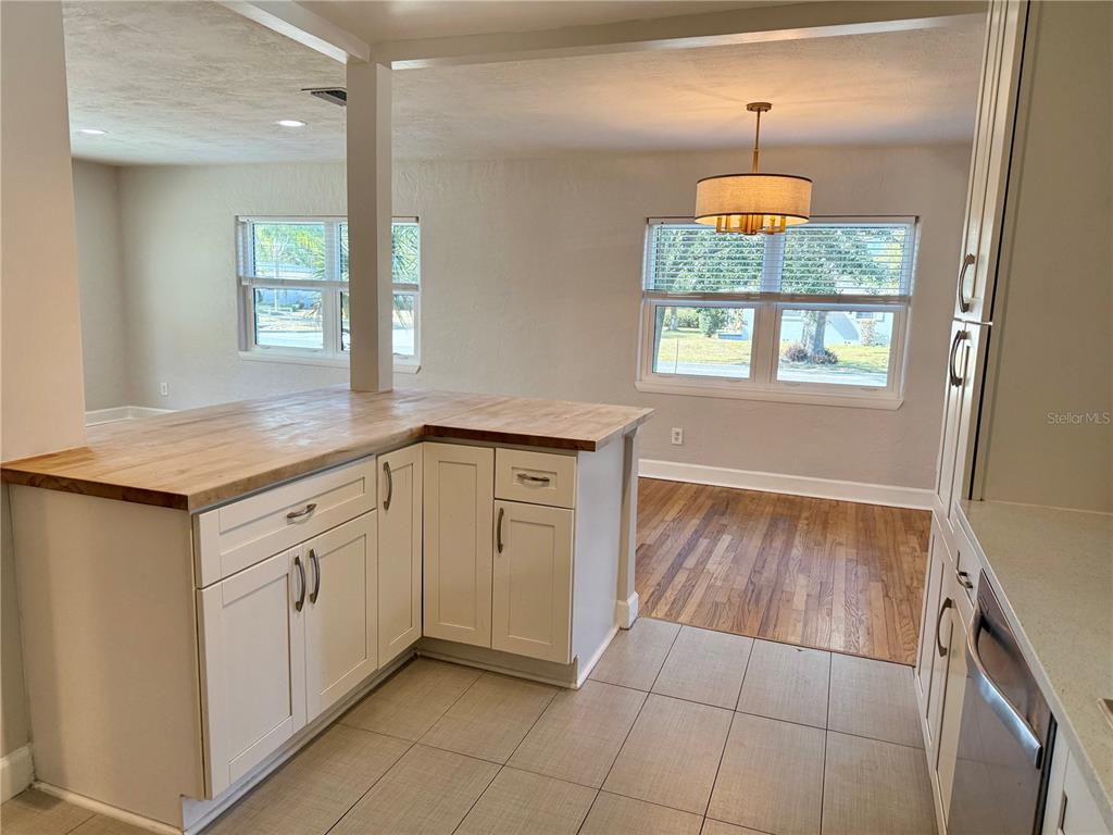 2801 Nancy Street Orlando, FL 32806 - Photo 12 of 39 a kitchen with a sink a stove and window