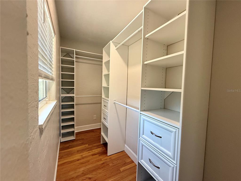 2801 Nancy Street Orlando, FL 32806 - Photo 20 of 39 a view of walk in closet with empty racks