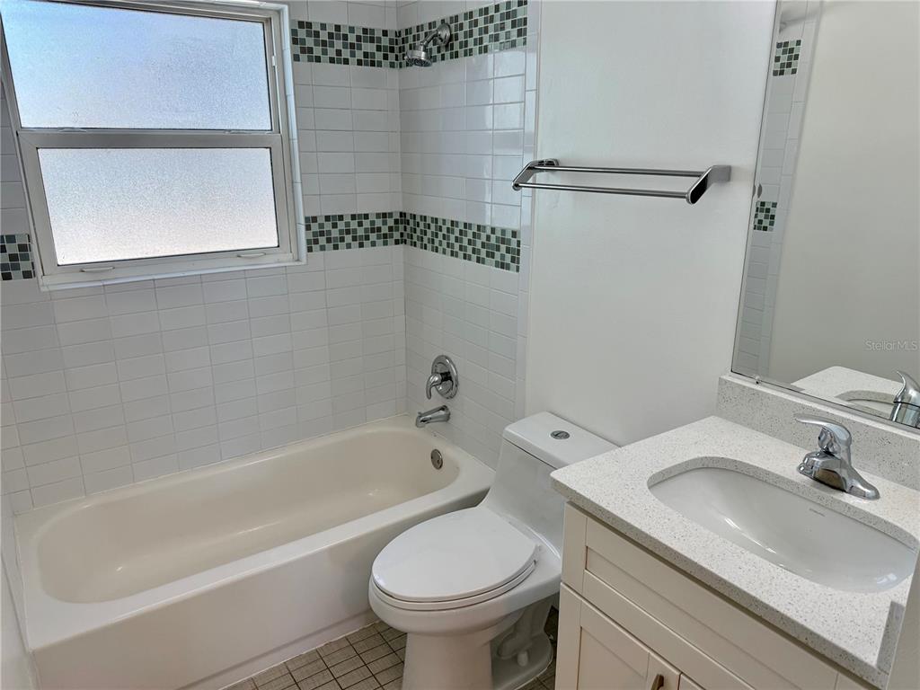 2801 Nancy Street Orlando, FL 32806 - Photo 9 of 39 a bathroom with a sink a toilet and shower